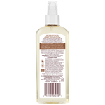 Back of Coconut Hydrate Body Oil bottle, highlighting fair trade coconut oil.